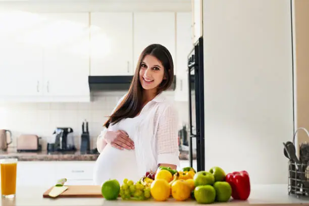 Shot of a young pregnant woman at home