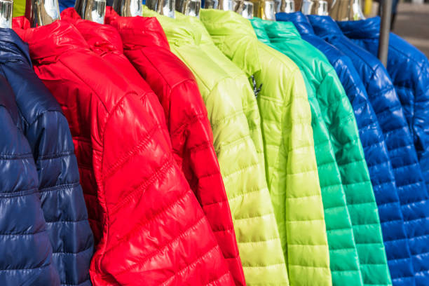 istock Winter clothes hanging at a store 804458418