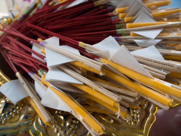 istock candle and incense sticks in temple, Thailand. 804462480