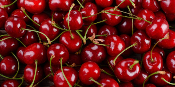 istock Ripe berries on wooden table 804487224