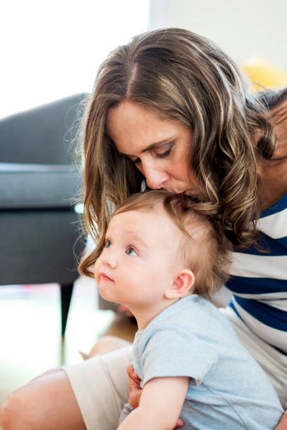 istock child kissed by his mum 804488312