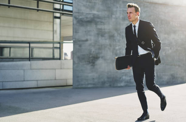 istock Cool handsome businessman walking with the skate 804490684