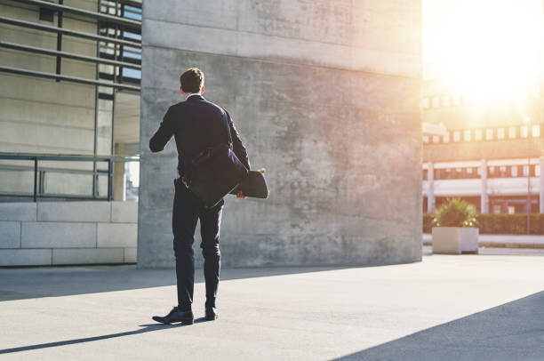 istock Stylish man wearing jacket standing with skateboard 804490948