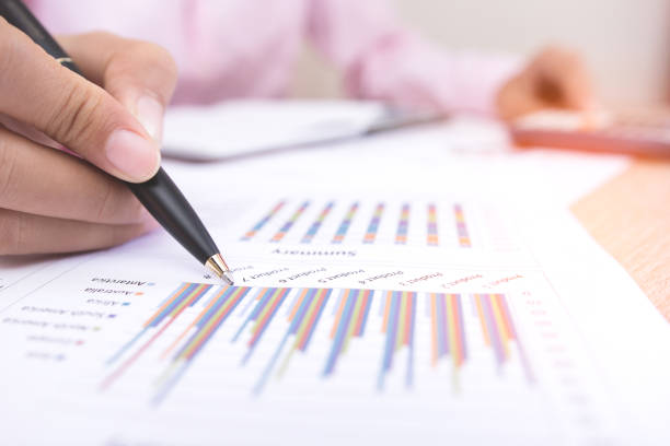 istock close up busninessman working with graph data at office,Finance managers task,Concept business and finance 804491372
