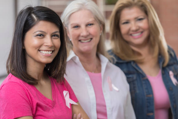 istock Three cancer survivors stand side by side and smile 804514944