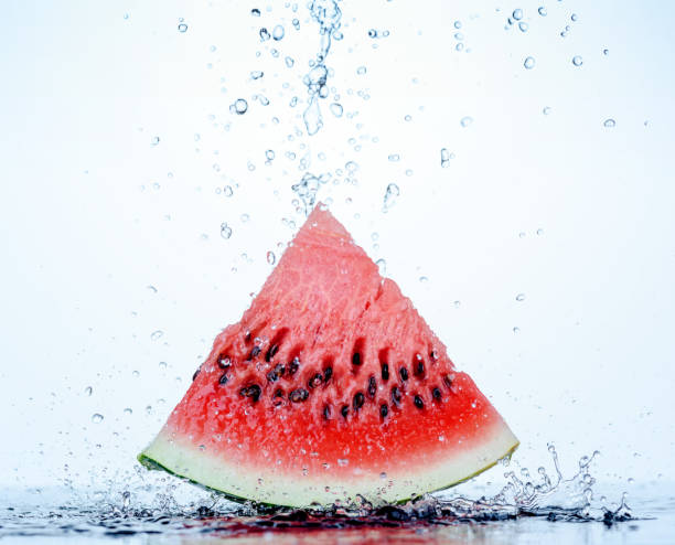 istock Fresh red watermelon slice with splash and drops of water 804516074