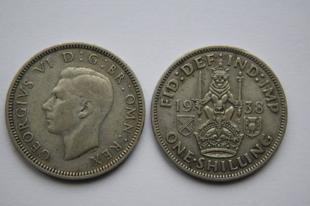 George VI shilling Image of both obverse and reverse of a 1938, George VI silver shilling george vi stock pictures, royalty-free photos & images