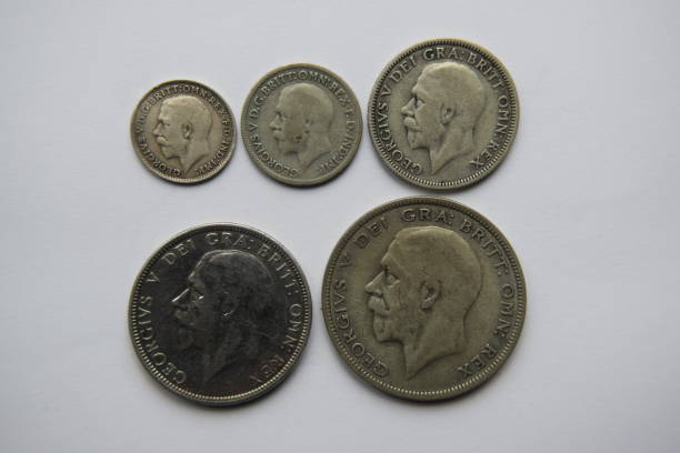 Selection of George VI silver coins, obverse Image of the obverse side of a selection of silver British coins including 3d, 6d, shilling, florin and half-crown george vi stock pictures, royalty-free photos & images