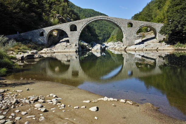 istock Amazing Reflection of Devil's Bridge in Arda river, Bulgaria 804529414