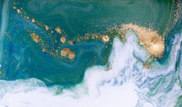 Marbled blue, green and golden abstract background. Liquid marble pattern.