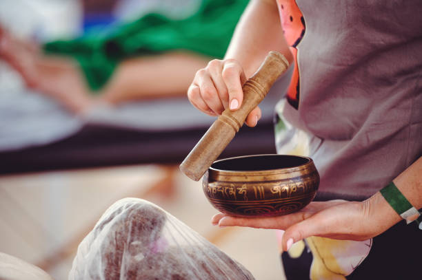 istock Massage with bamboo sticks and Tibetan bowl 804532526
