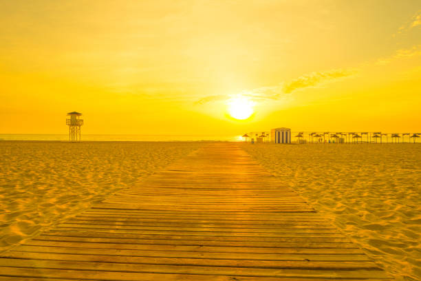Sunrise in orange  over a beach in summer