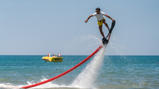 Flyboard extreme sport adventure skateboard  on the water.