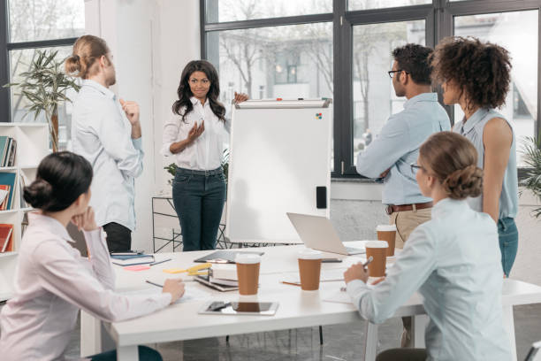 istock young multiethnic group of businesspeople during workshop at office 804574664