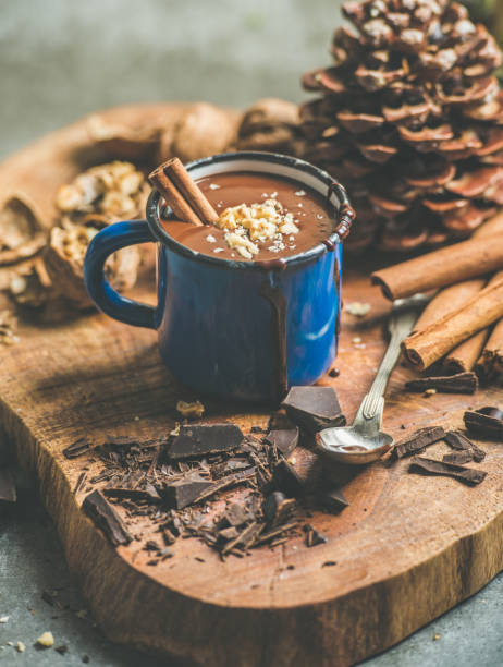 istock Rich winter hot chocolate with cinnamon and walnuts in mug 804575276