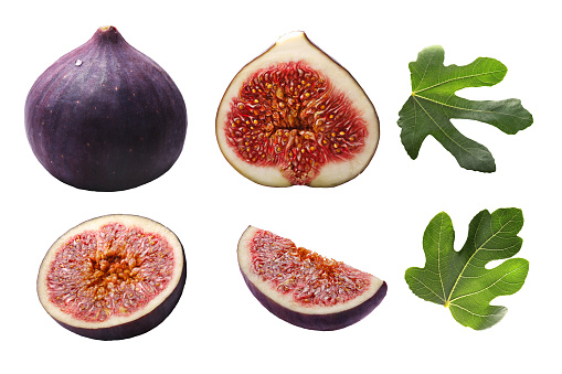 Fig fruits (Ficus carica), whole, halves, slices, leaves. Clipping paths, shadowless