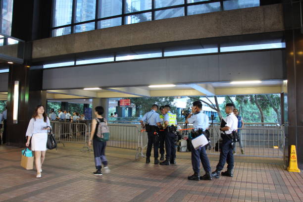 Police officers guard the area while within the Harbour Centre in Wan Chai, close to where President Xi Jinping is active on his official visit to Hong Kong There was heavy police presence in the Wan Chai locality of Hong Kong due to the Chinese President Xi Jinping being in the area, on the first day of him being in Hong Kong for the trip. While many police vehicles and police officers conduct security operations at ground level, many police officers of various ranks are seen working from height to guard the area, as seen in this photo. xi jinping stock pictures, royalty-free photos & images