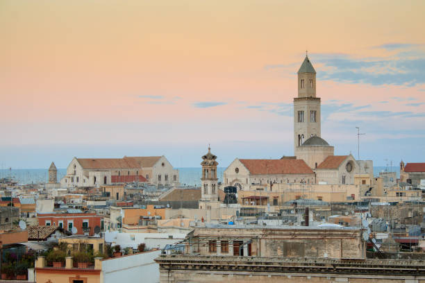 Cityscape of Bari at sunset with Basilica of San Nicola and Romanesque Cathedral Cityscape of Bari at sunset with Basilica of San Nicola and Romanesque Cathedral bari photos stock pictures, royalty-free photos & images
