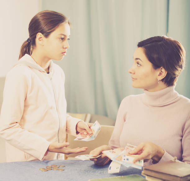 istock Daughter asks cash from mother 804605476