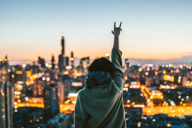 Female Standing in Front of Modern City