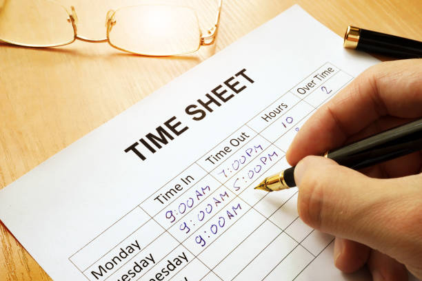 Records work hours in a time sheet. Records work hours in a time sheet. arrival departure board photos stock pictures, royalty-free photos & images