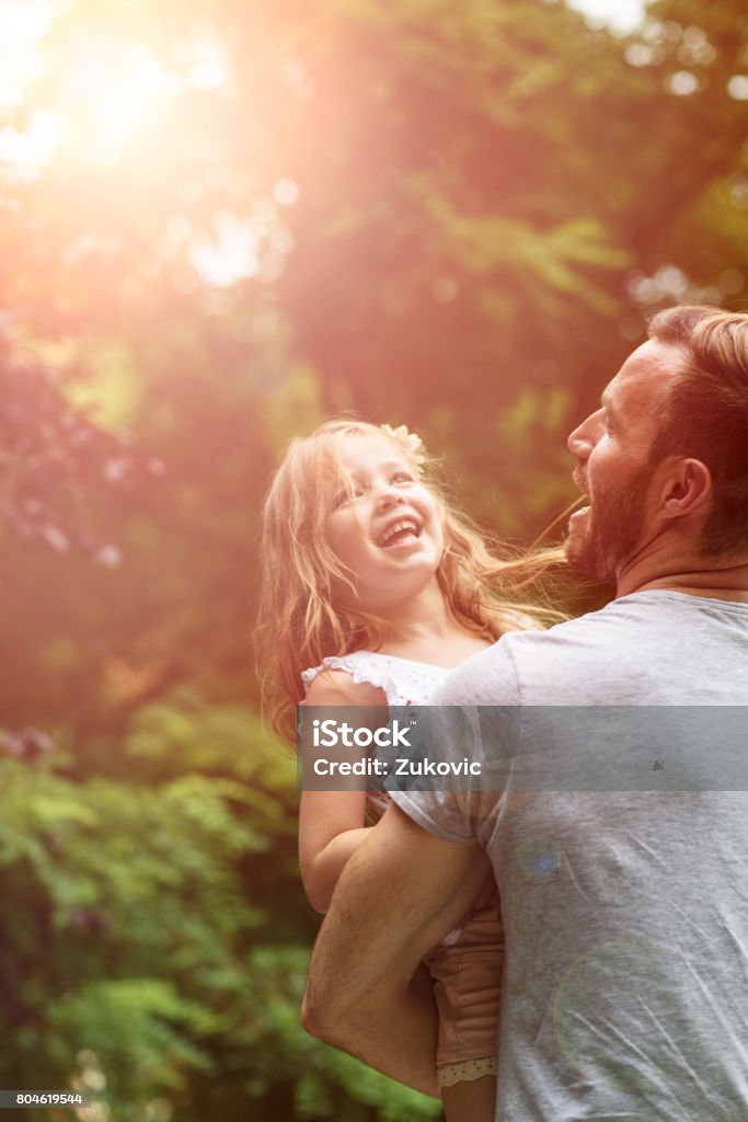 Family happiness Father and Daughter having fun in a park Family Stock Photo