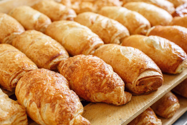 istock Puff pastry on wooden board. morning at the bakery 804641514