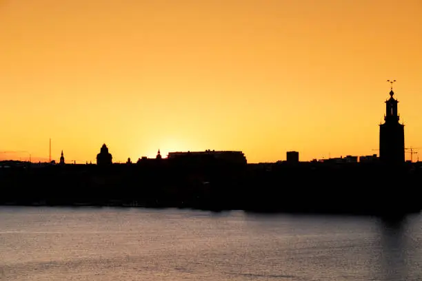 View from the Monteliusvägen, a 500 m long walking path with a beautiful view during sunset on Lake Mälaren,the City Hall and the island of Riddarholmen.