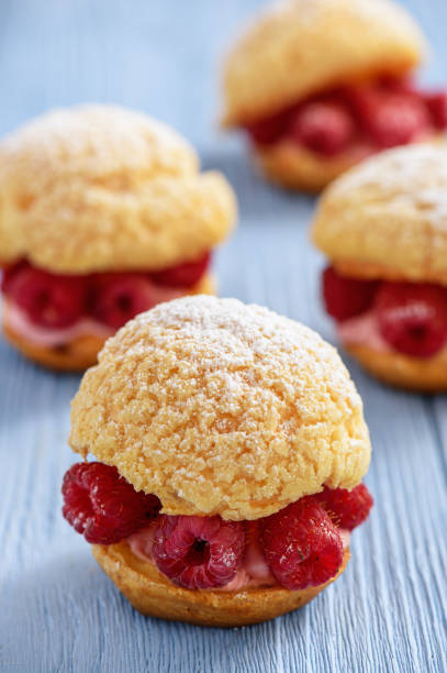 istock Eclairs with mascarpone cream and raspberries. 804649256