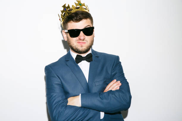 istock Man in crown with hands crossed 804655096