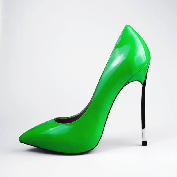 istock green female shoes over white 804656118