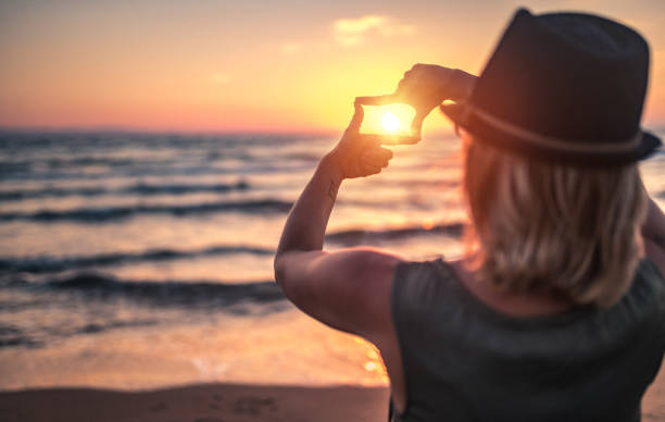istock Searching for best composition standing near sea at sunset 804664724