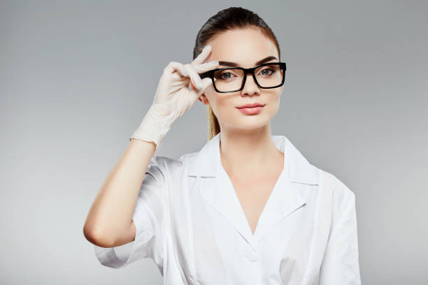istock Beautiful nurse in white medical robe 804665438
