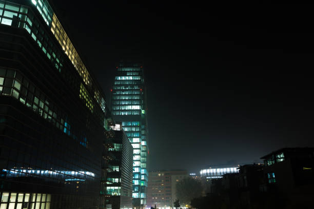 Financial district night view. Modern skyscrapers in Gae Aulenti square. Unicredit bank tower