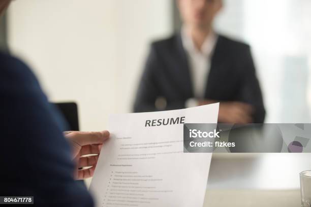 Job Interview In Office Focus On Resume Close Up View Stock Photo - Download Image Now