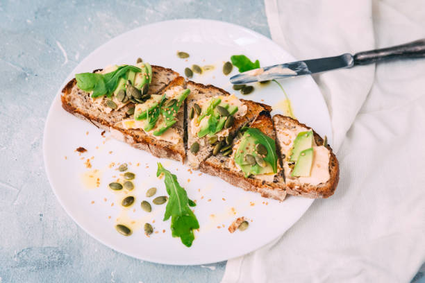 istock toasted rye bread with sliced avocado and herbs, simple rustic sandwich 804674626