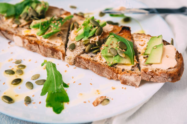 istock toasted rye bread with sliced avocado and herbs, simple rustic sandwich 804674648