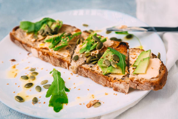 istock toasted rye bread with sliced avocado and herbs, simple rustic sandwich 804674690