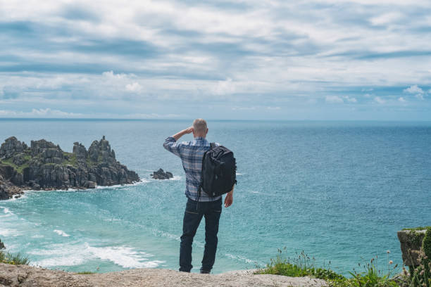 istock Man stood on cliffs above Pedn Vounder Beach, South Cornwall. 804684924