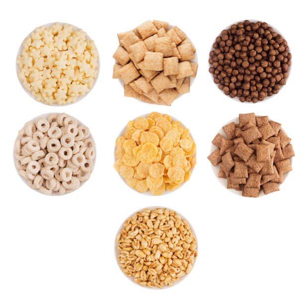 istock Corn flakes collection in white bowls, top view, isolated on white background. 804685390