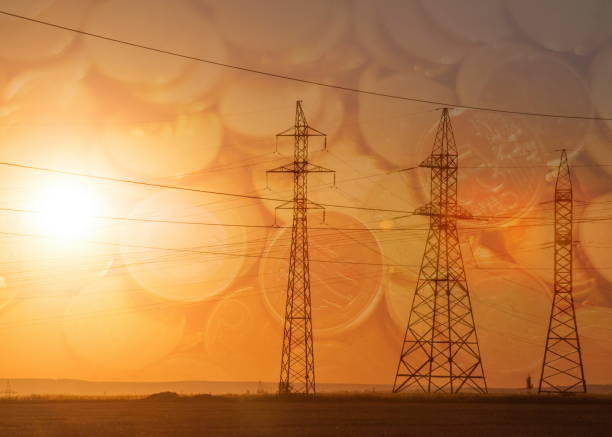 istock High-voltage power transmission line. Energy pillars. At sunset, Euro banknotes 804685728