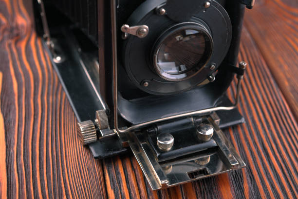 istock The old film camera on wooden table. 804701570