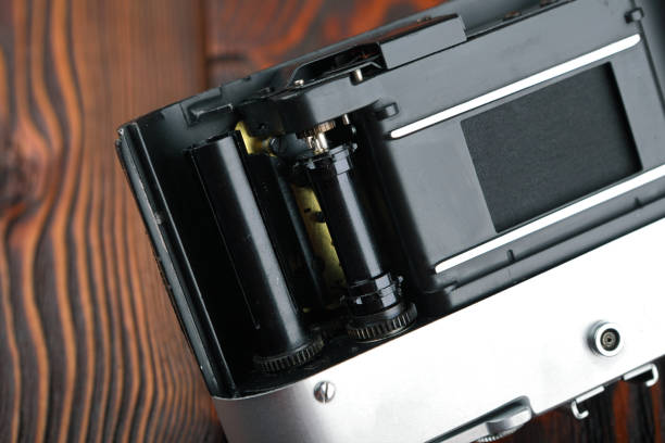 istock The old film camera on wooden table. 804701580