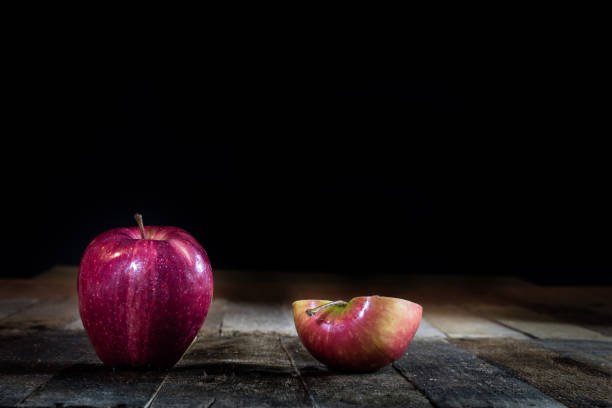 istock Red tasty wet apple on a wooden table 804701632