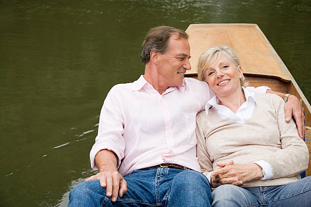 Mature couple on a boat  couple punting stock pictures, royalty-free photos & images