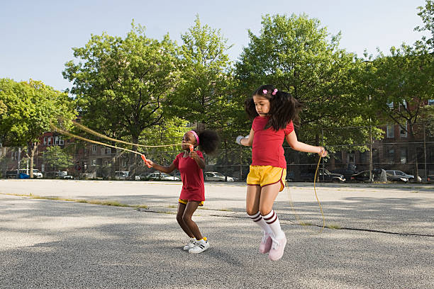 Girls skipping  jump rope stock pictures, royalty-free photos & images