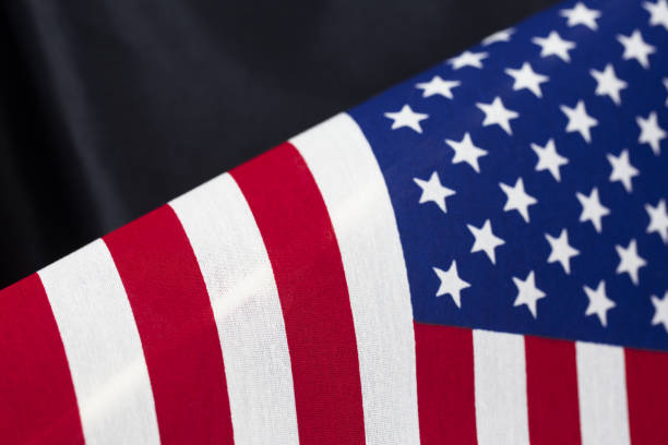 istock Background of stars and stripes flag pattern against black satin 804705936