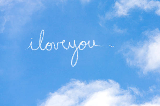 i love you written in vapour - skywriting стоковые фото и изображения