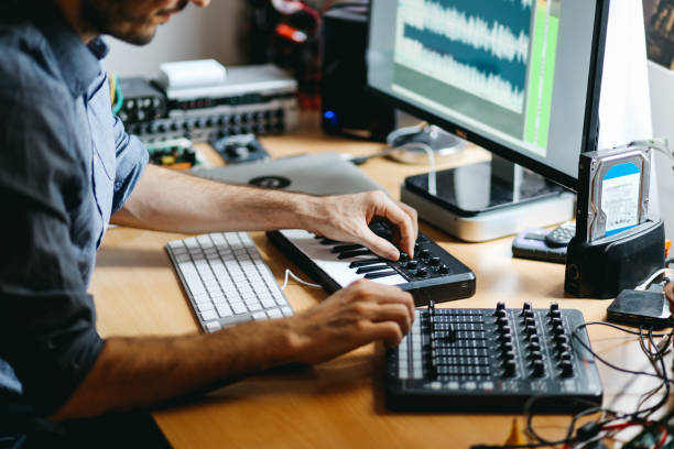 Young man creating music at home