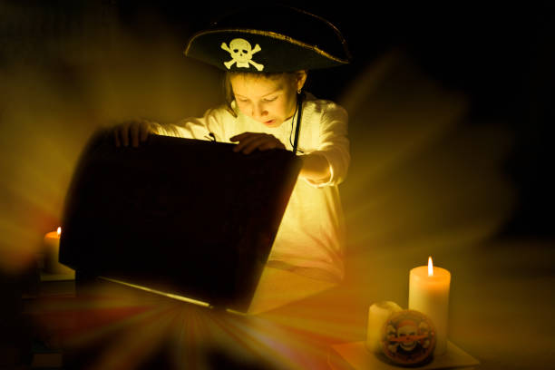 Childhood dreams. Adventurous girl found a treasures. Childhood dreams. Adventurous girl found a treasures. Happy young pirate. child casket stock pictures, royalty-free photos & images